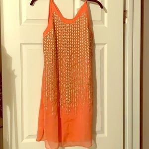 A knee length CORAL dress